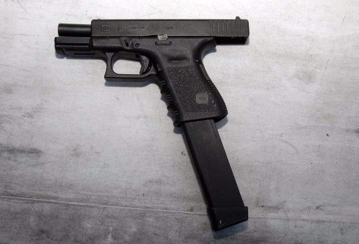 This is not the exact gun used by California shooter Ian David Long, but it shows what a extended magazine looks like. The device is attached to a Glock 9mm gun in this photo.