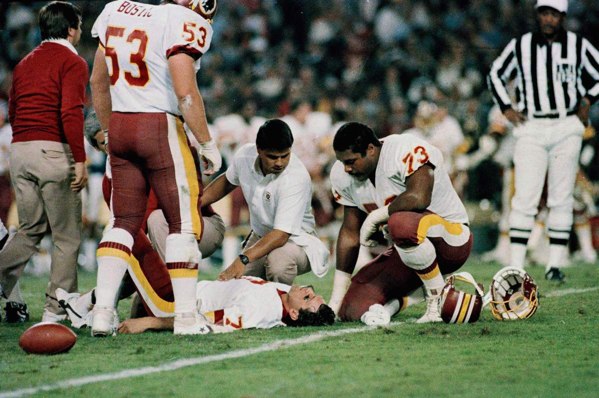 In this Nov. 18, 1985, file photo, Washington Redskins quarterback Joe Theismann lies on the ground after he injured his right leg during the first half of an NFL game against the New York Giants at RFK Stadium in Washington. Former NFL quarterback Joe Theismann saw the video of Boston Celtics forward Gordon Hayward’s broken left ankle and immediately felt a kind of empathy few could.