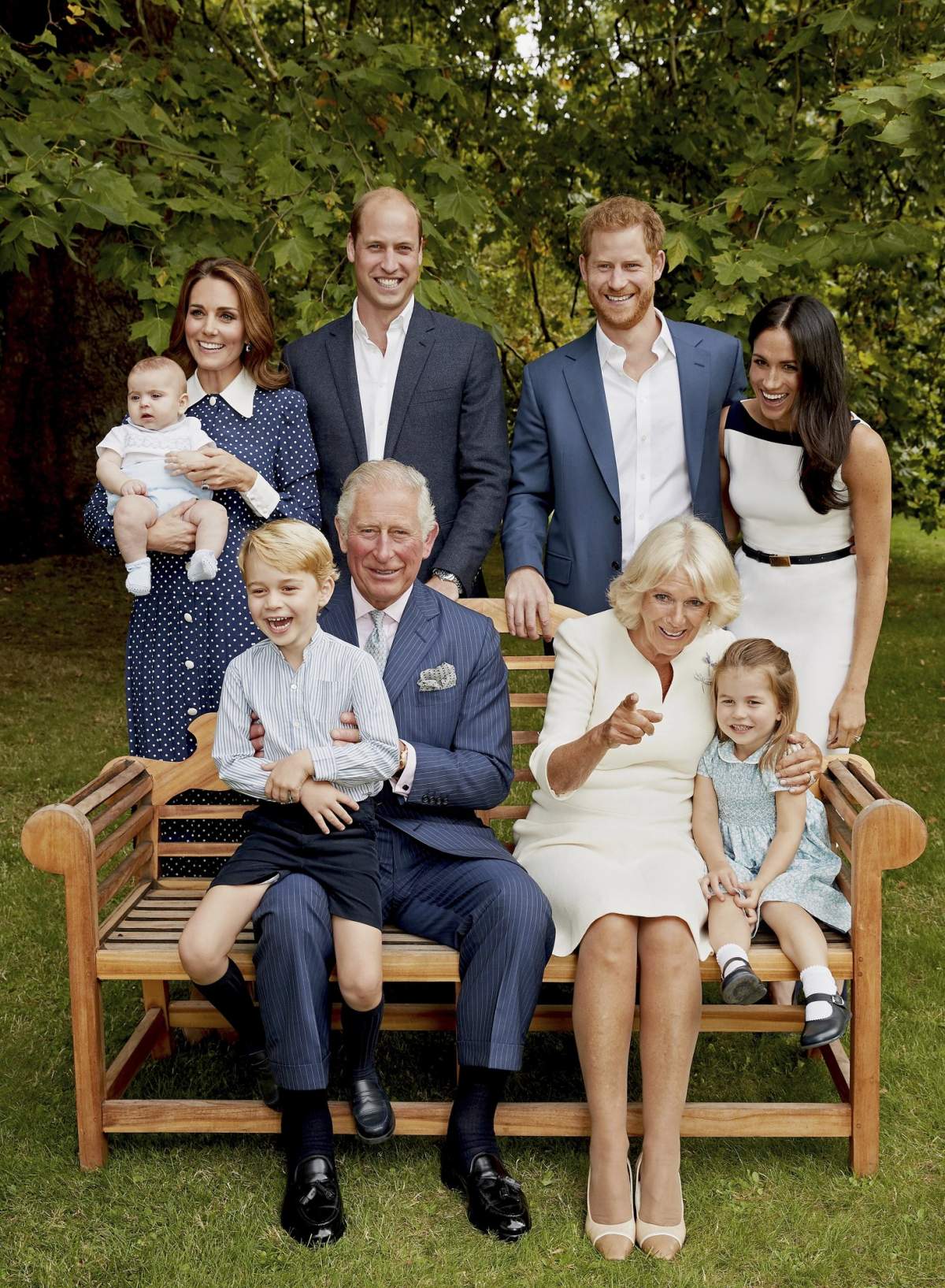 Prince Charles poses for an official portrait to mark his 70th Birthday in the gardens of Clarence House, with Camilla, Duchess of Cornwall, Prince William, Kate, Duchess of Cambridge, Prince George, Princess Charlotte, Prince Louis, Prince Harry and Meghan, Duchess of Sussex, in London, England. (Chris Jackson/Pool Photo)