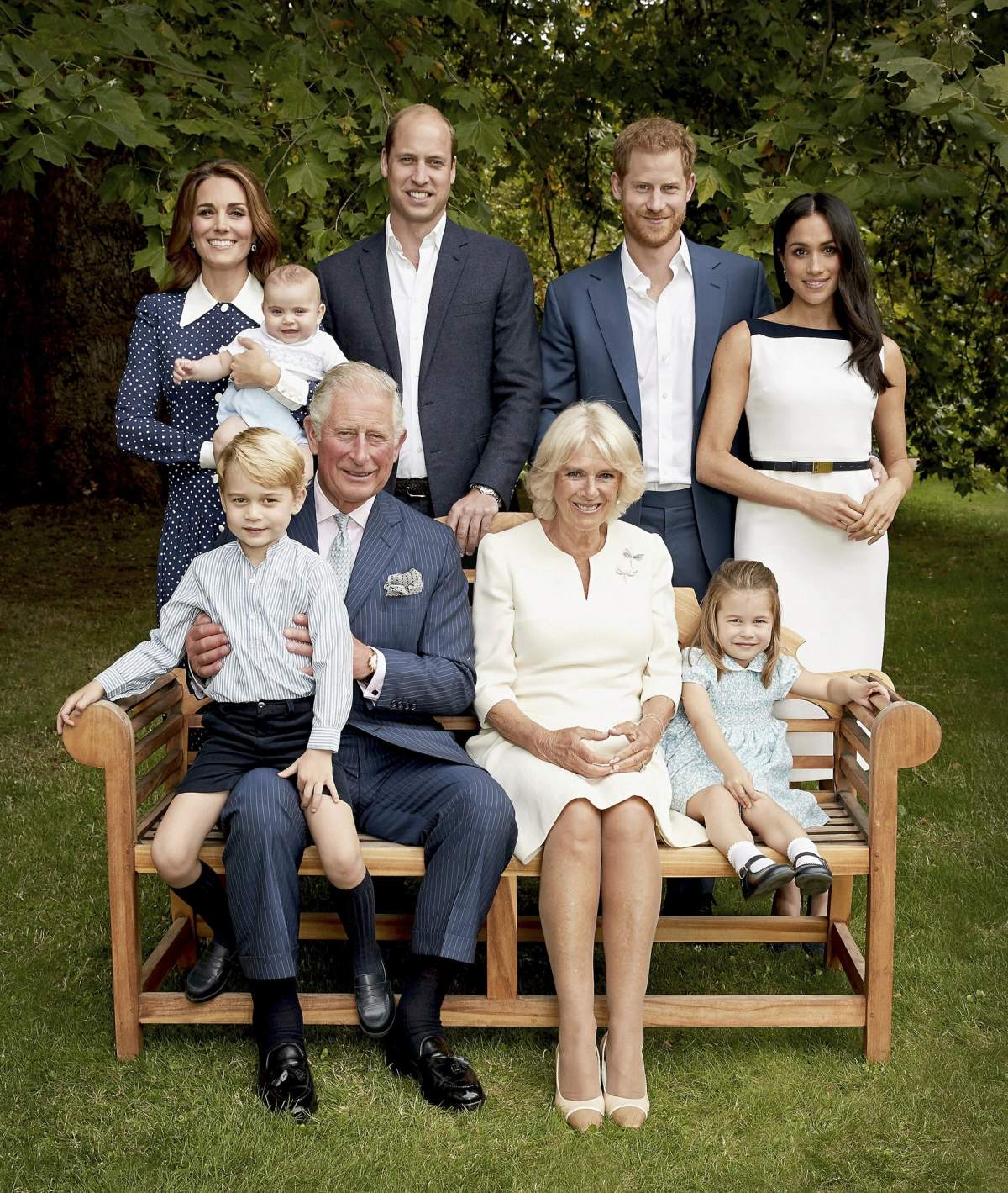 Prince Charles poses for an official portrait to mark his 70th Birthday in the gardens of Clarence House, with Camilla, Duchess of Cornwall, Prince William, Kate, Duchess of Cambridge, Prince George, Princess Charlotte, Prince Louis, Prince Harry and Meghan, Duchess of Sussex, in London, England. (Chris Jackson/Pool Photo)