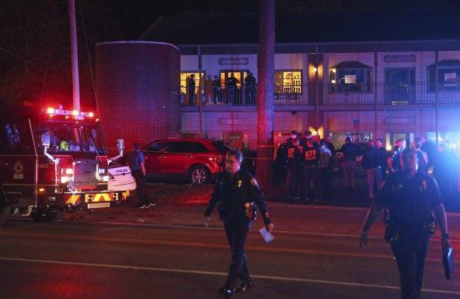 Police investigators work the scene of a shooting, Nov. 2, 2018, in Tallahassee, Fla.