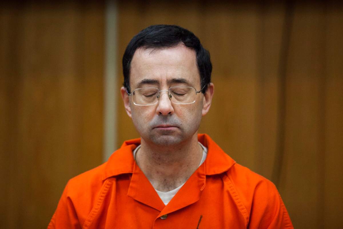 In this Feb. 5, 2018, file photo, Larry Nassar listens during his sentencing at Eaton County Circuit Court in Charlotte, Mich. 