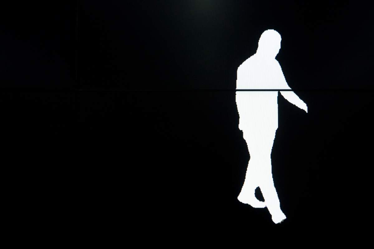 In this Oct. 31, 2018, photo, a screen displays a computer-generated image of a Watrix employee walking during a demonstration of their firm's gait recognition software at their company's offices in Beijing.
