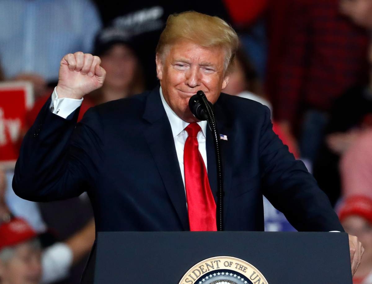President Donald Trump pumps his fist as he speaks during a campaign rally Monday, Nov. 5, 2018, in Cape Girardeau, Mo.