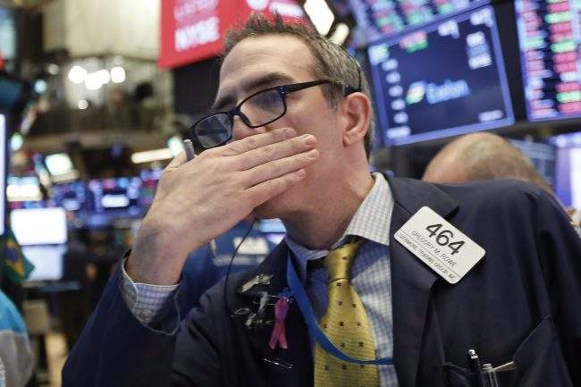 A trader works on the floor of the New York Stock Exchange, Thursday, Nov. 8, 2018. 