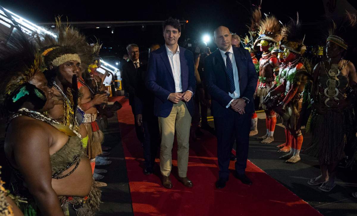 Canadian Prime Minister Justin Trudeau is greeted by Charles Abel, Deputy Prime Minister and Treasurer of Papua New Guinea as he arrives in Port Moresby, Papua New Guinea.