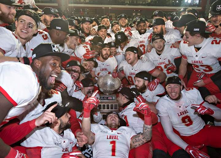 Members of the Laval University Rouge et Or celebrate their victory against Western University Mustangs at the Vanier Cup final Saturday, November 24, 2018 in Quebec City. Laval won 34-20. 