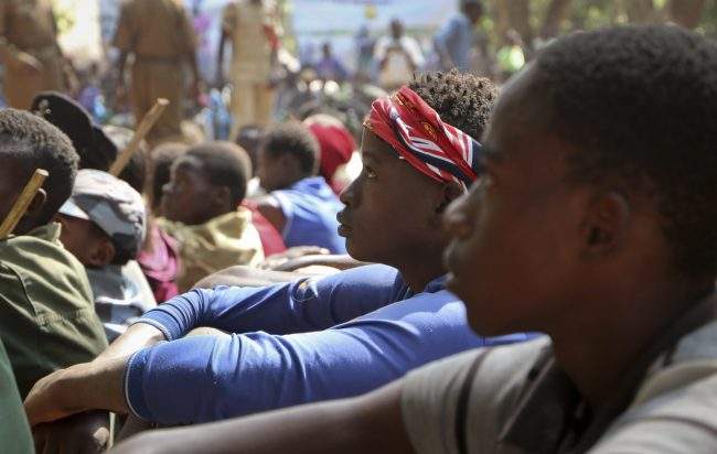 Former child soldiers attend a release ceremony where they laid down their weapons and traded in their uniforms to return to “normal life”, in Yambio, South Sudan, Feb. 7, 2018.