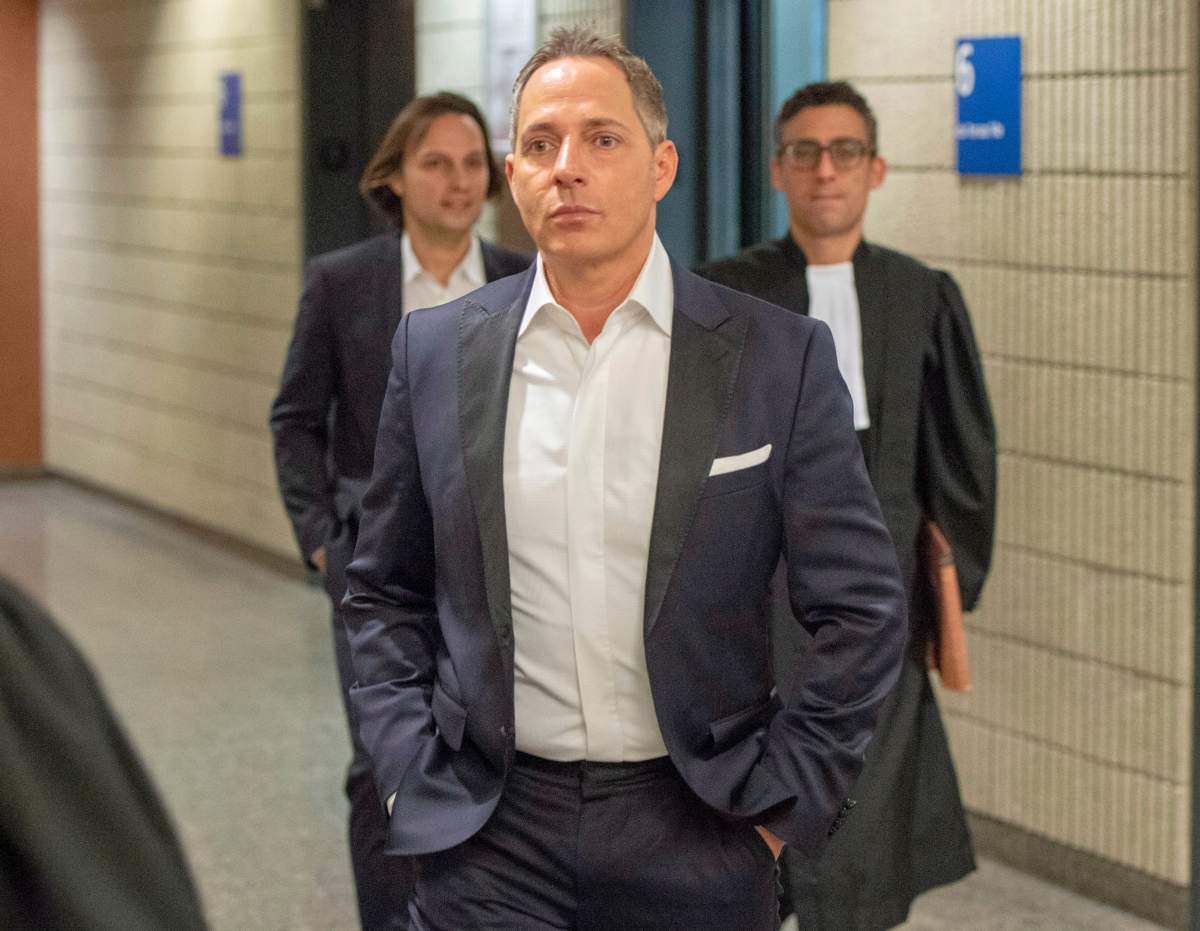 Yanai Elbaz, front, and his brother Yohann Elbaz, left, arrive for their fraud trial at the courthouse in relation to the MUHC hospital Monday, November 26, 2018 in Montreal.