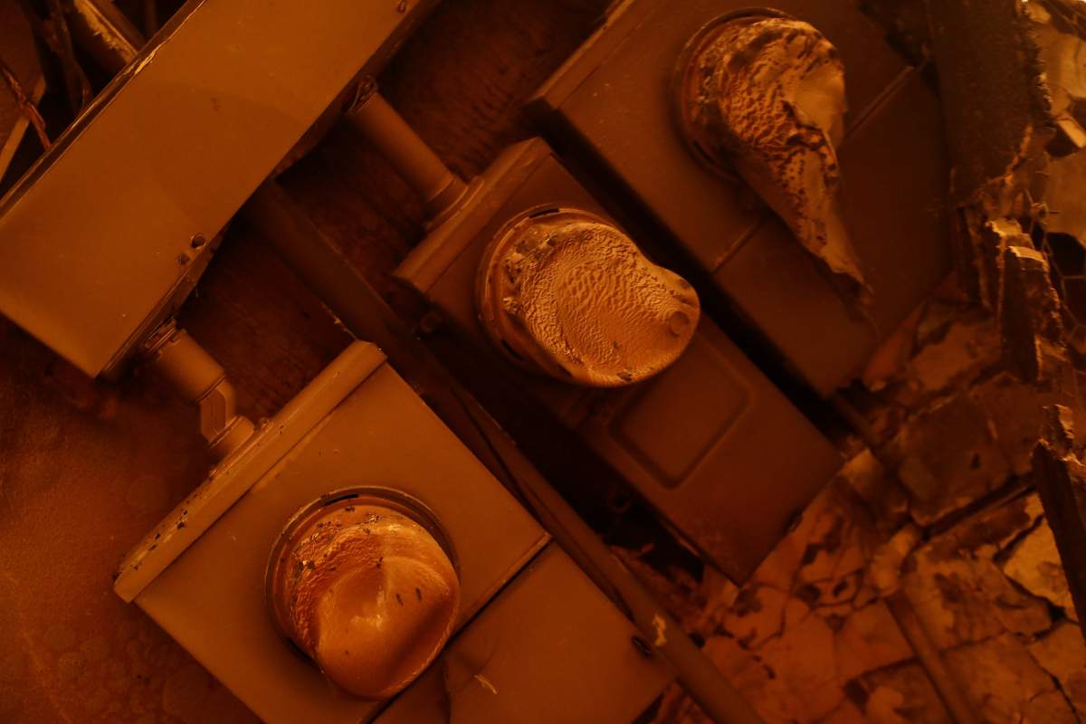 A row of damaged electrical meters are seen during the Camp Fire in Paradise, California, U.S., November 9, 2018.