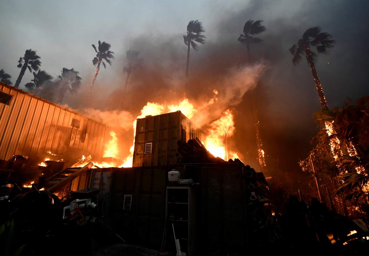A home is engulfed in flames during the Woolsey Fire in Malibu, California, U.S. November 9, 2018.