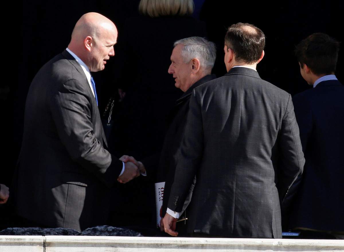 Acting U.S. Attorney General Matthew Whitaker shakes hands with U.S. Secretary of Defense James Mattis after ceremonies on Veteran’s Day at Arlington National Cemetery in Arlington, Virginia, U.S., November 11, 2018.