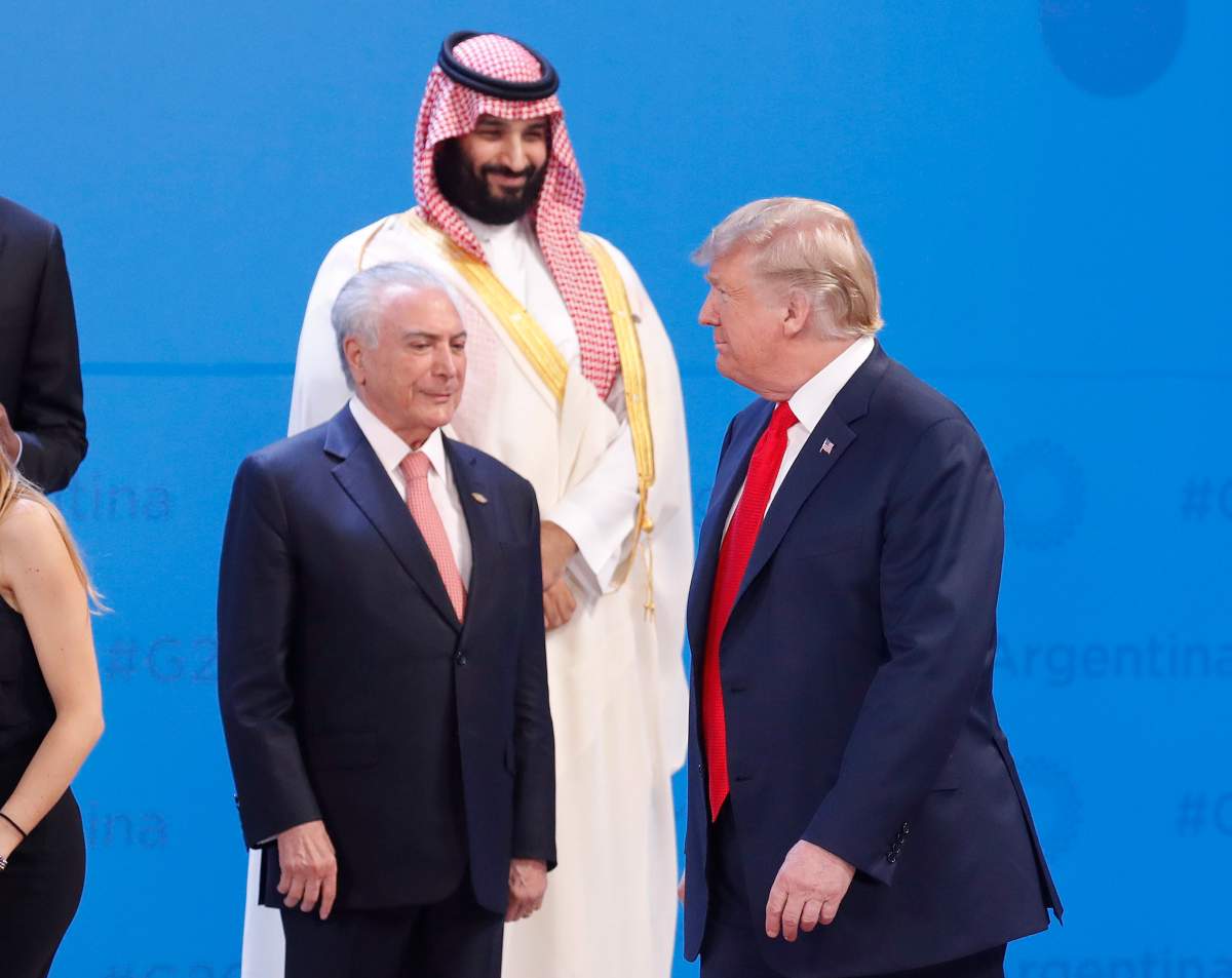 Saudi Arabia’s Crown Prince Mohammed bin Salman, center top, watches President Donald Trump, right, walk past as Brazil’s President Michel Temer, left, stands by while leaders gather for the group photo at the start of the G20 summit in Buenos Aires, Argentina.