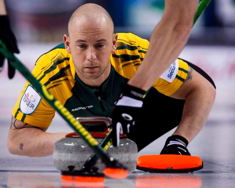 Northern Ontario third Ryan Fry makes a shot as his team plays Newfoundland and Labrador during curling action at the Brier in Calgary, Thursday, March 5, 2015. THE CANADIAN PRESS/Jeff McIntosh.
