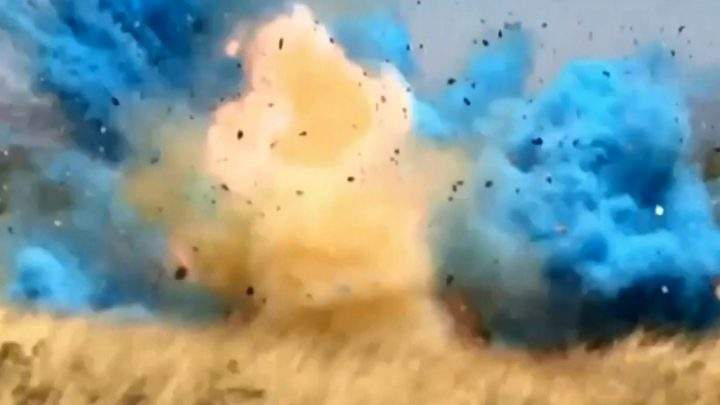 An explosive package filled with coloured powder detonates in this still image captured from video in April 2017, near Tucson, Arizona.