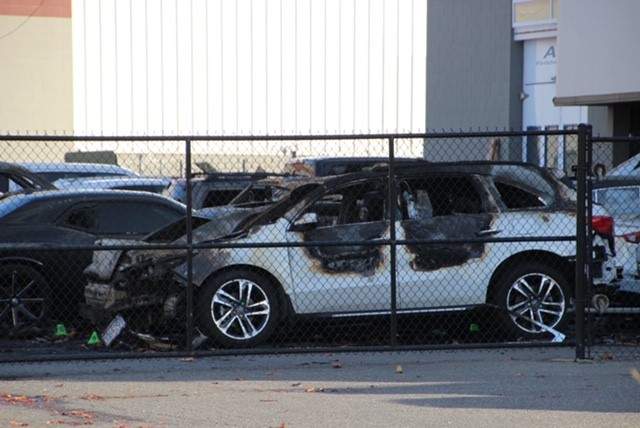 One of several burned-out cars that investigators believe may have been deliberately set on fire. 