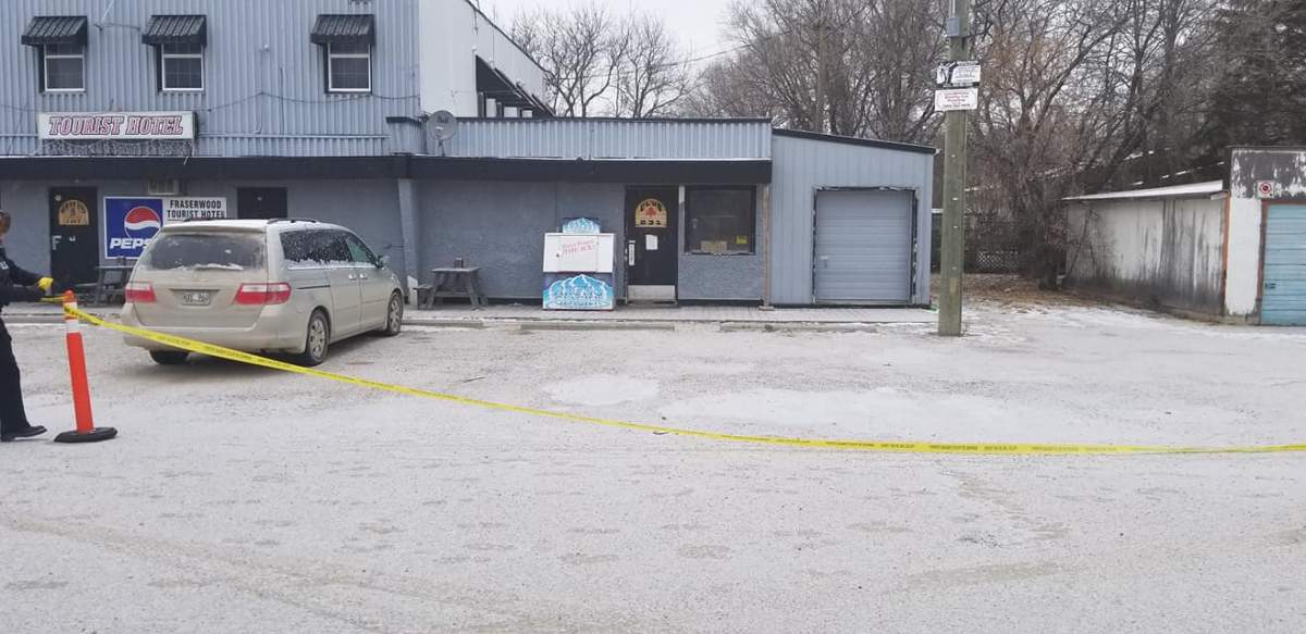 Police tape outside the Fraserwood Tourist Hotel Sunday.