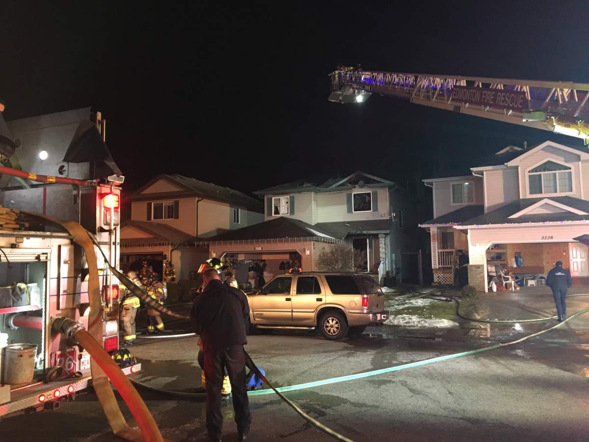 Crews put out hot spots at a home in the Silver Berry neighbourhood.