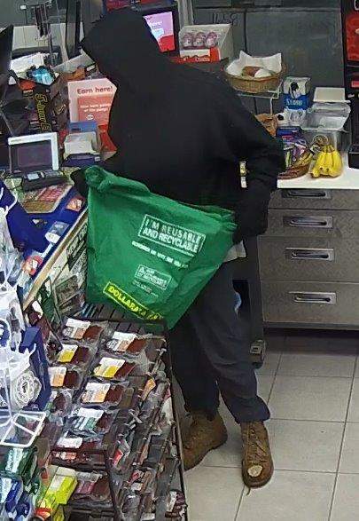 Police are seeking to identify a man accused of robbing a business in Huntsville.