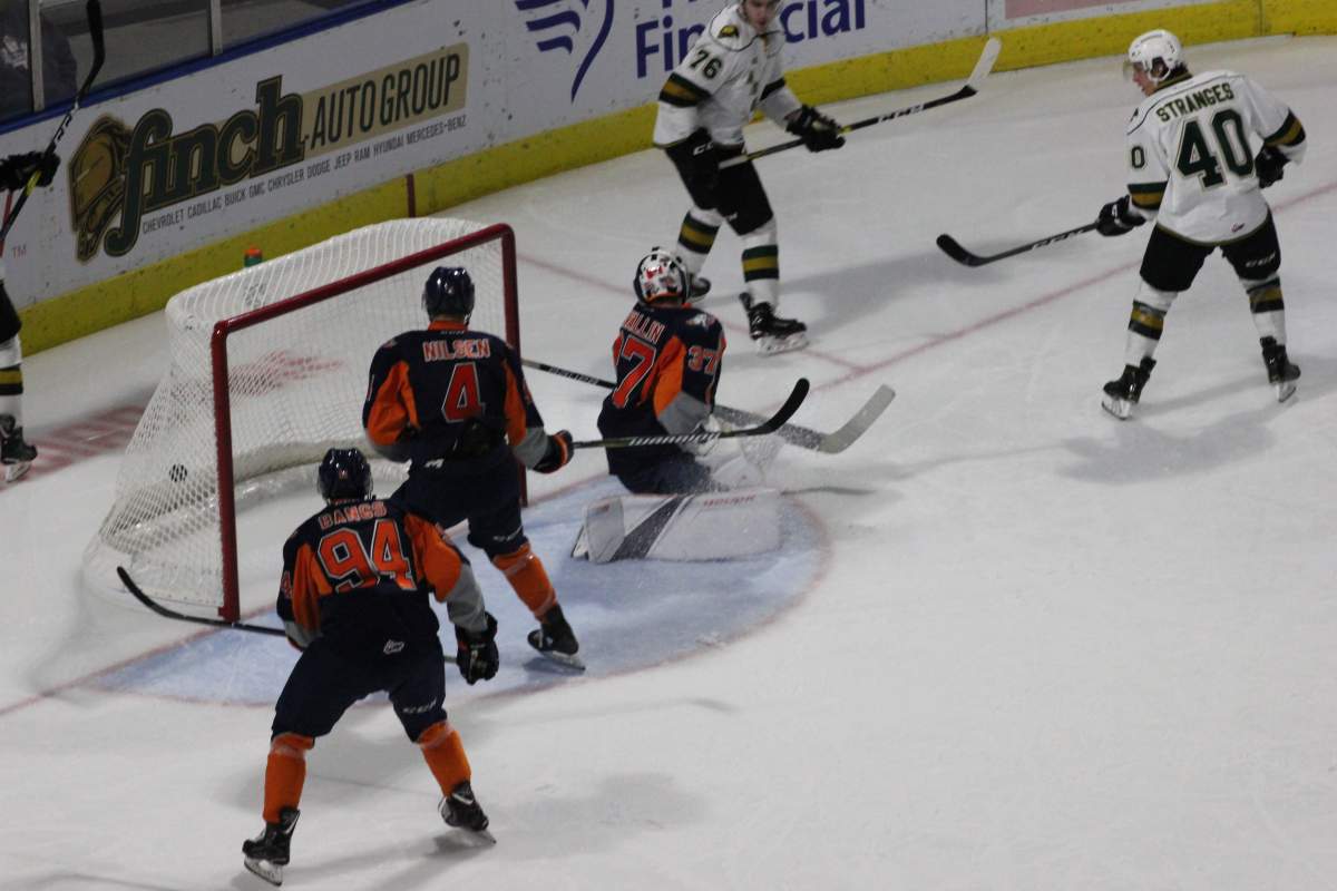 Tonio Stranges (#40) of the London Knights lifts a backhand past goaltender Luke Cavallin of the Flint Firebirds in a 6-2 London victory at Budweiser Gardens.