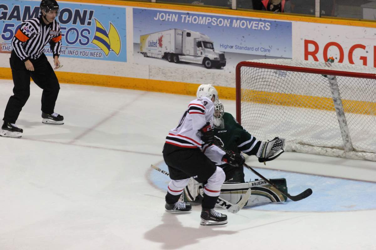 Jordan Kooy denies Maksim Susko of Owen Sound in the final shootout attempt by the Attack to seal a 6-5 victory.