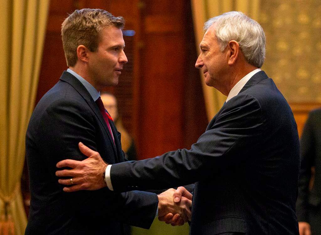 New Brunswick Progressive Conservative leader and Premier-designate Blaine Higgs shakes hands with outgoing premier and New Brunswick Liberal leader Brian Gallant following the Throne Speech at the New Brunswick Legislature in Fredericton on Friday, Nov. 2, 2018. THE CANADIAN PRESS/James West