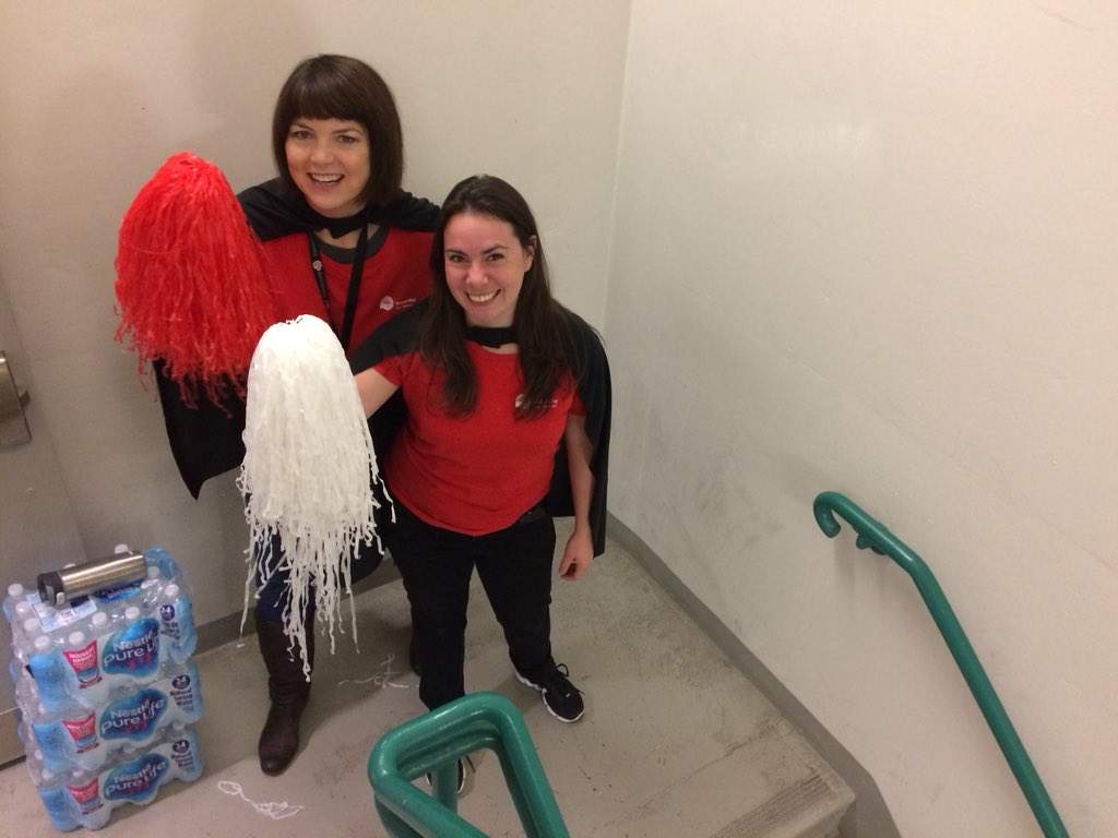 Maura Brisbane and Kara O’Ray are sponsored employees, who are giving stairclimbers encouragement at the 10th floor.
