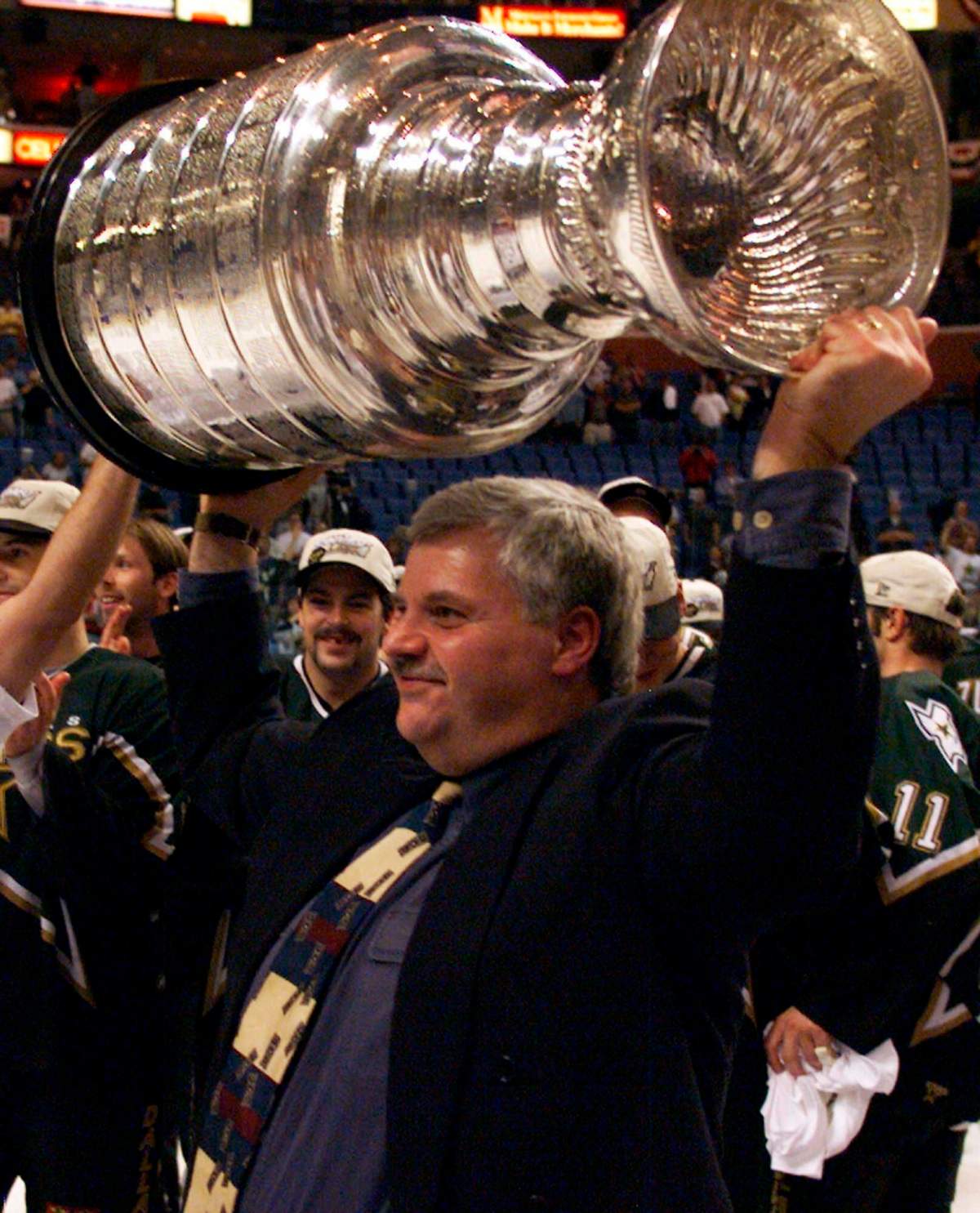 In this June 20, 1999, file photo, Dallas Stars coach Ken Hitchcock hoists the Stanley Cup after the Stars defeated the Buffalo Sabres 2-1 in triple overtime in Game 6 of the Stanley Cup finals in Buffalo, N.Y.