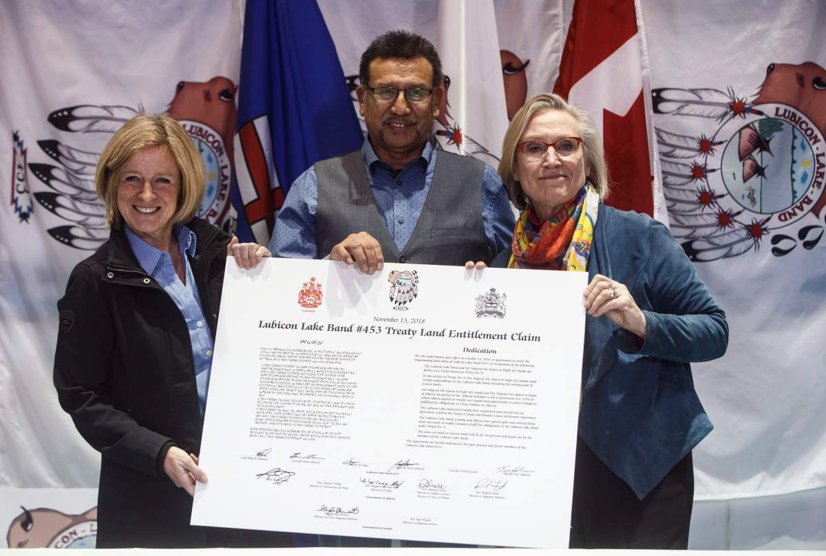 Alberta Premier Rachel Notley, Chief Billy Joe Laboucan and Minister of Crown Indigenous Relations Carolyn Bennett sign a historic land deal with the Lubicon Lake First Nation, in Little Buffalo, Alta. on Tuesday November 13, 2018.