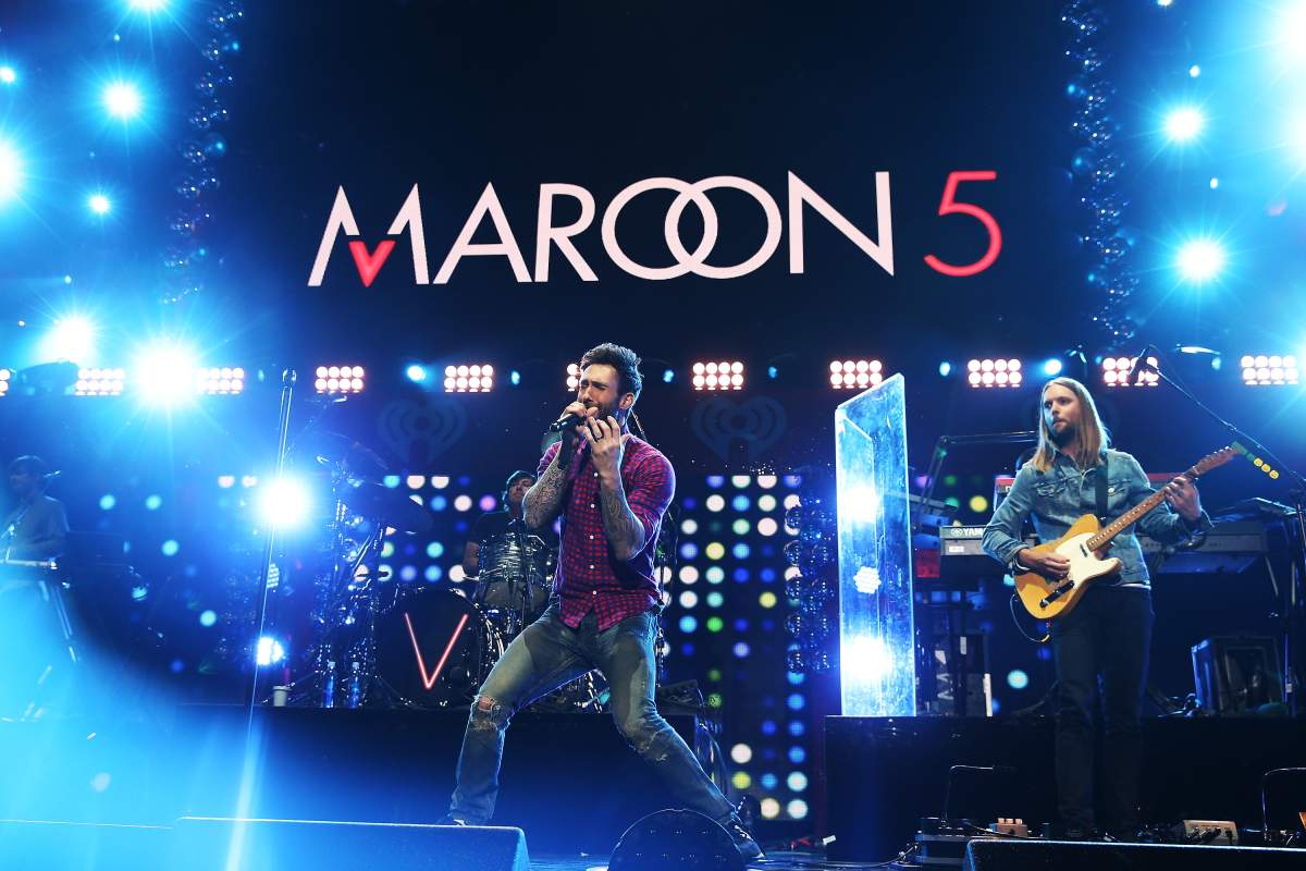 Adam Levine (L) and James Valentine of Maroon 5 onstage during iHeartRadio Jingle Ball at Madison Square Garden on Dec. 12, 2014, in New York City.