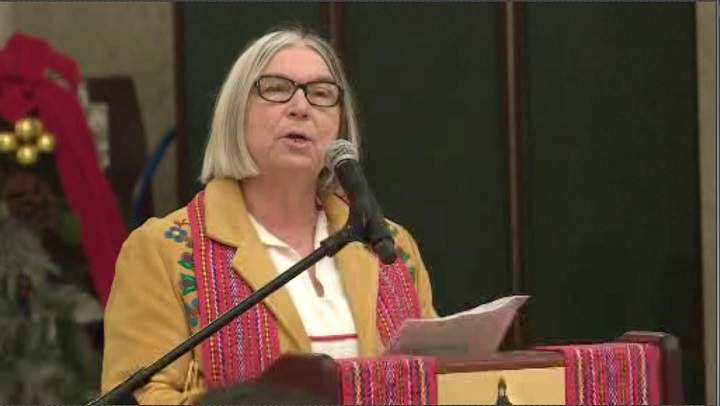 Audrey Poitras, president of the Métis Nation of Alberta, speaks at a ceremony.