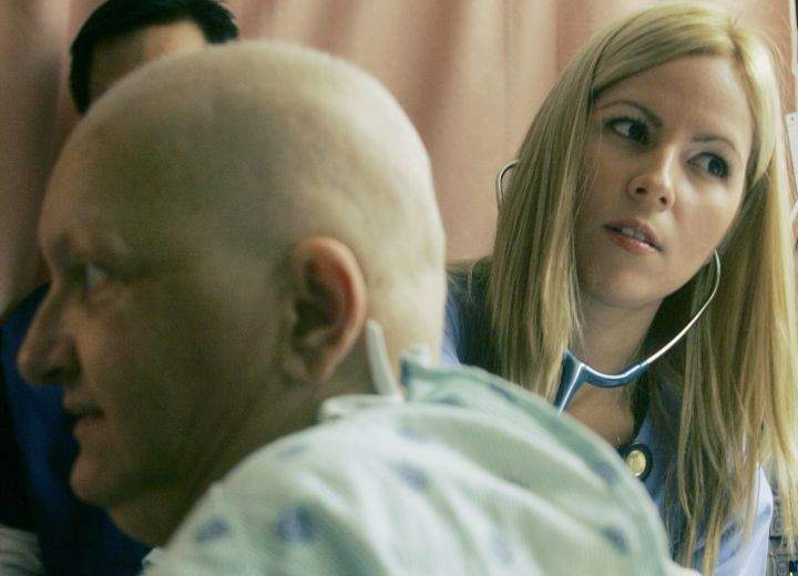 File: A nurse tends to a patient on Friday, Feb. 6, 2009.
