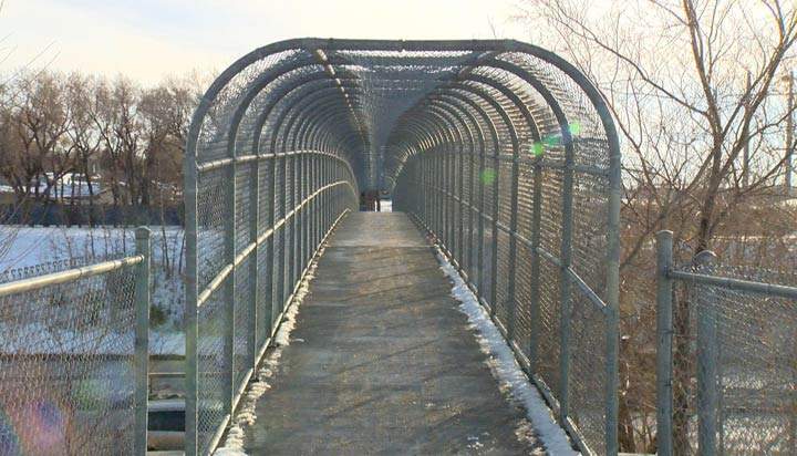 Police say two similar robberies took place on the same pedestrian overpass in Saskatoon earlier this month.