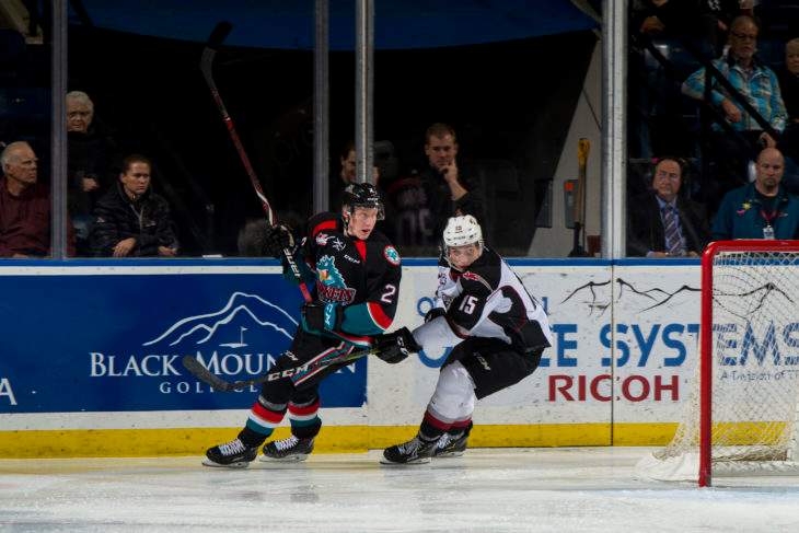 KELOWNA, CANADA - NOVEMBER 28:  Owen Hardy #15 of the Vancouver Giants stick checks Lassi Thomson #2 of the Kelowna Rockets during second period on November 28, 2018 at Prospera Place in Kelowna, British Columbia, Canada.  (Photo by Marissa Baecker/Shoot the Breeze).