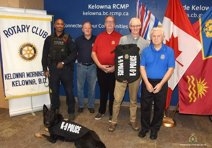 Reg Sahay, left, and RCMP canine member Ice, were on hand as members of the Kelowna Morningside Rotary Club donated K9 protection vests. Representing the Kelowna Morningside Rotary Club were, from left, Rod McMorran, Christopher Penty, Doug Herman and Graham Allcock.