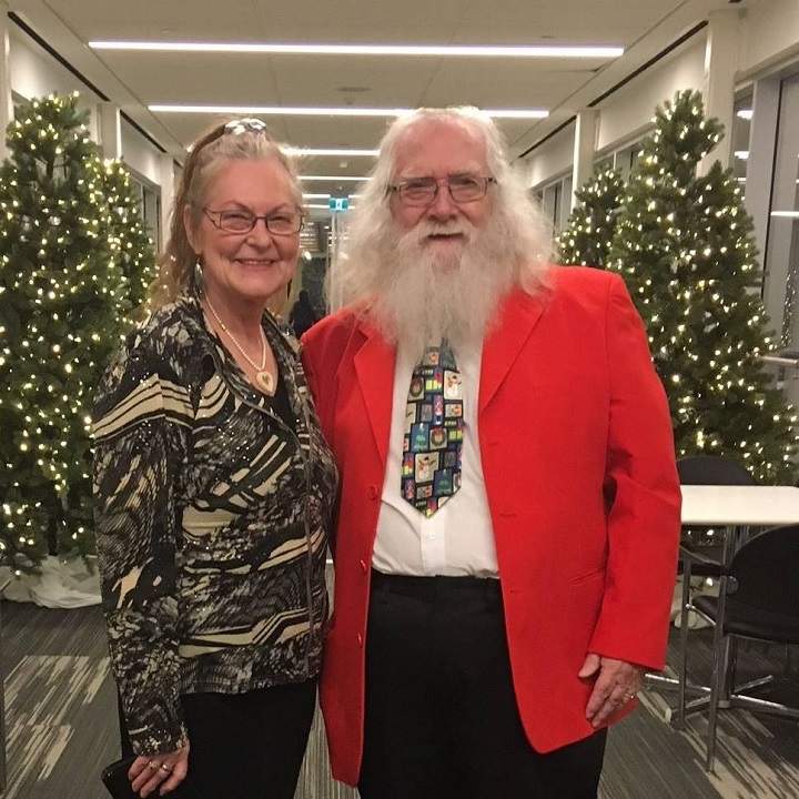 Brian Sanderson (right) poses with Lillian Harrison. The pair worked together as Mr. and Mrs. Claus helpers at their local mall for eight years.