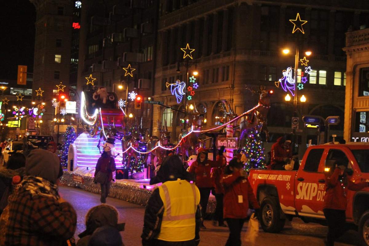 The one and only, Santa Claus makes his way down Portage Avenue.