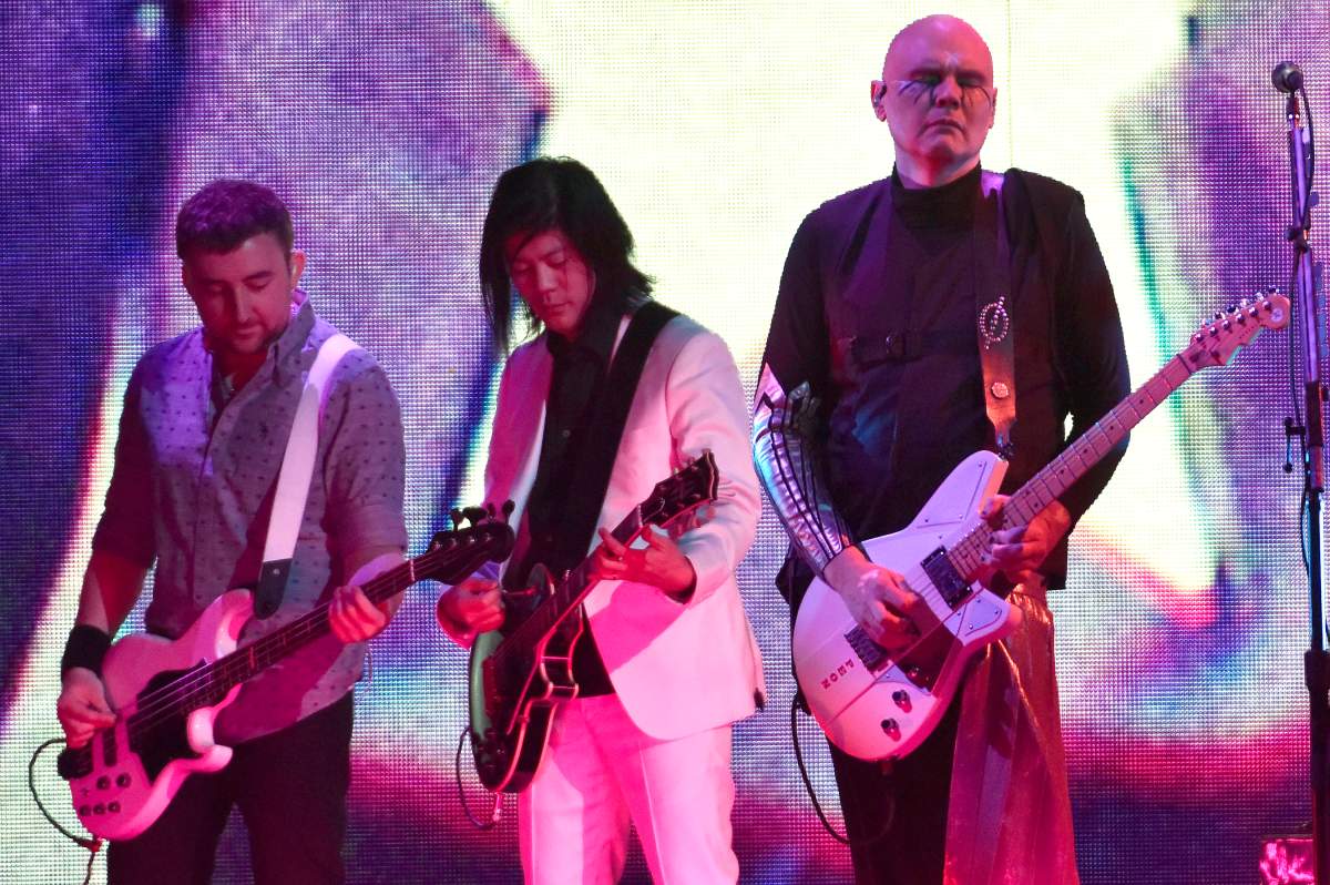(L-R) Jeff Schroeder, James Iha and Billy Corgan of Smashing Pumpkins on ‘The Shiny and Oh So Bright’ tour at Golden 1 Center on Aug. 28, 2018, in Sacramento, Calif.