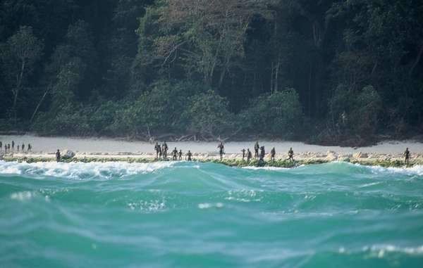 Tribespeople seen on the shores of a North Sentinel island beach in an undated photo.