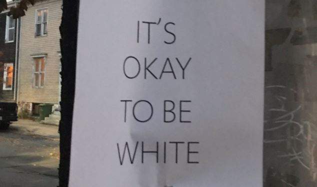Signs that read "It's okay to be white" where posted around Halifax on Halloween.