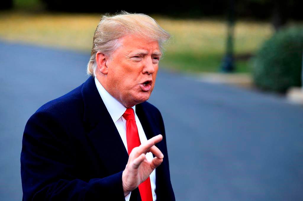 President Donald Trump speaks to the members of the media before leaving the White House in Washington, Friday, Nov. 2, 2018, for a campaign rally in Huntington, W.Va., and Indianapolis. (AP Photo/Manuel Balce Ceneta).