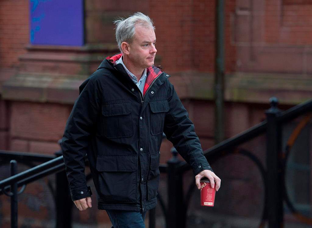 Dennis Oland arrives at the Law Courts in Saint John, N.B., on Nov. 6, 2018. THE CANADIAN PRESS/Andrew Vaughan