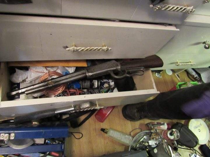 Five people were charged after Calgary police seized drugs, guns and bikes from a house in the city's northwest.