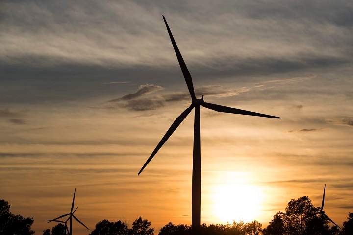 Wind turbines on Wolfe Island during sunset in Marysville, Ont. on Monday, Sept. 3, 2018. 