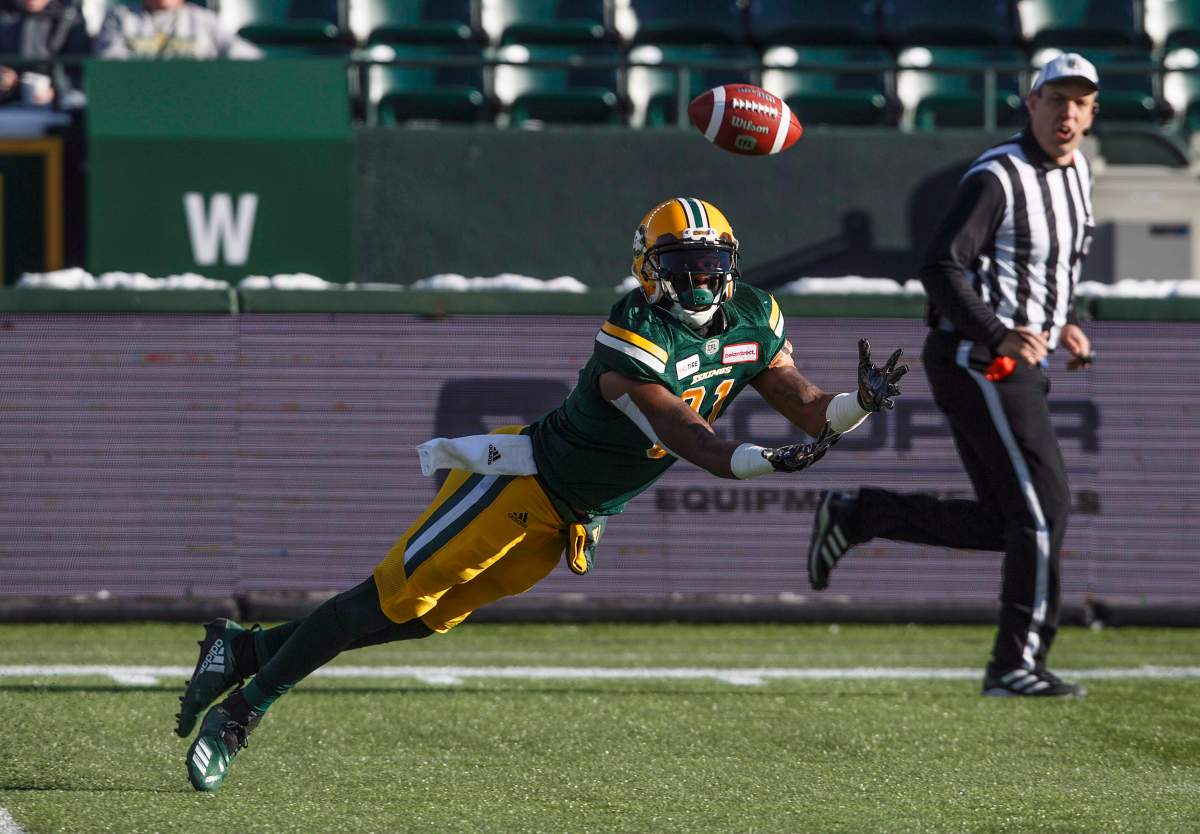 Edmonton Eskimos D'haquille Williams (81) dives for the ball against the Winnipeg Blue Bombers during first half CFL action in Edmonton, Alta., on Saturday November 3, 2018. 