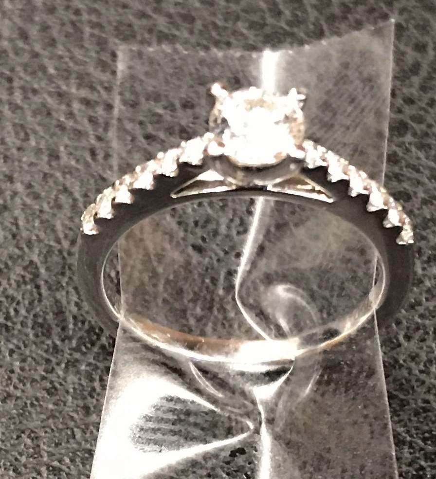 In this Dec. 1, 2018 photo provided by the New York City Police Department, an engagement ring recovered by the NYPD below a Times Square utility grate is shown in New York.