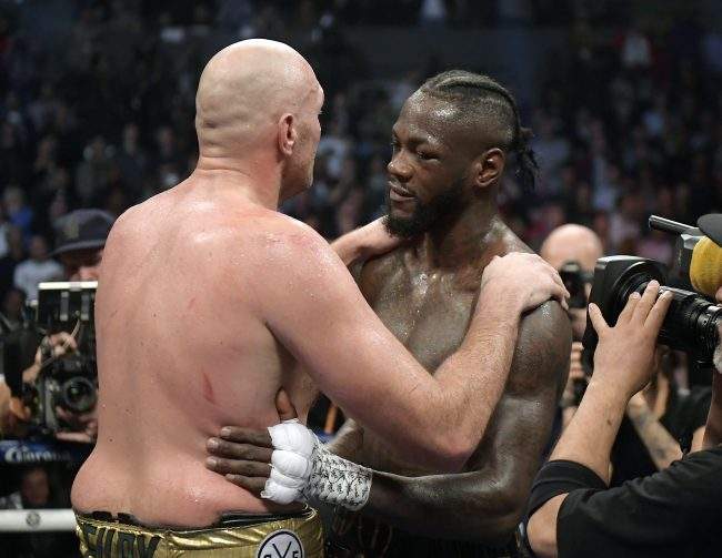 Tyson Fury and Deontay Wilder embrace after their WBC heavyweight championship boxing match, Saturday, Dec. 1, 2018, in Los Angeles.