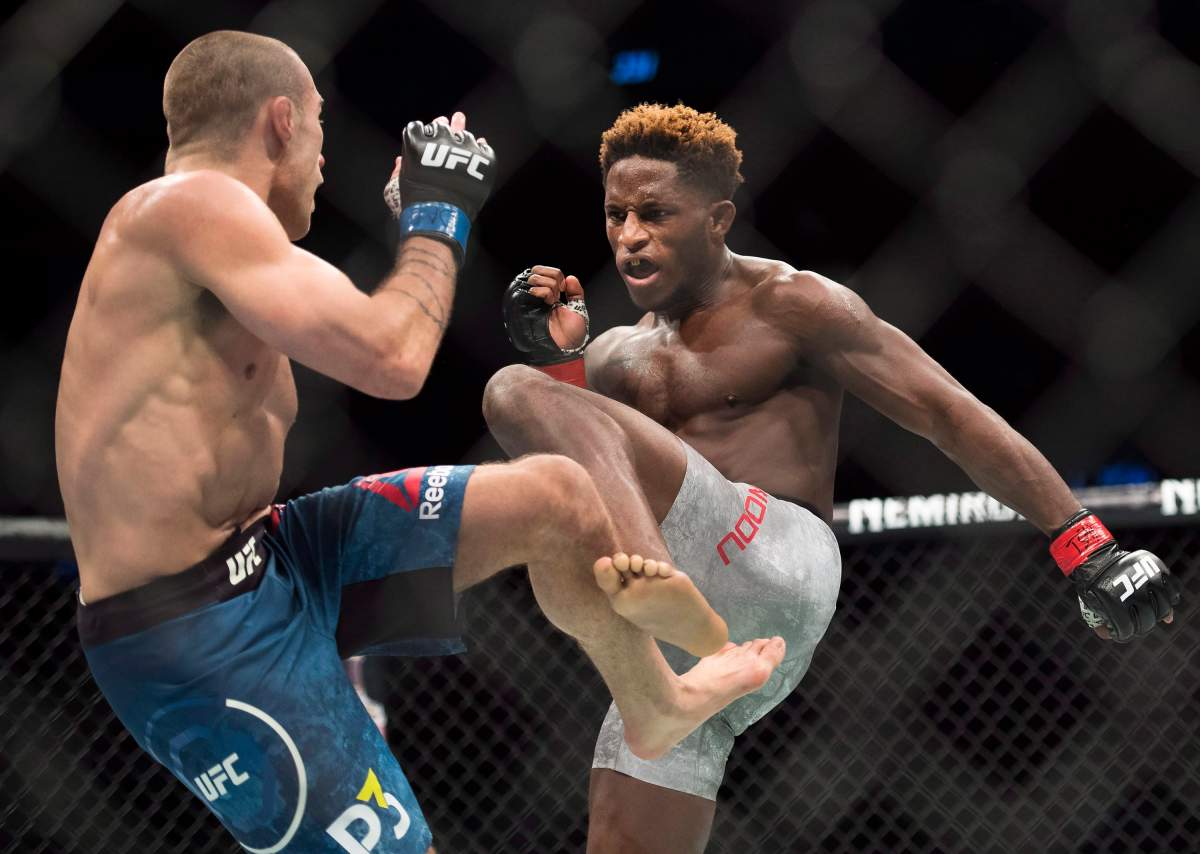 Hakeem Dawodu, right, fights Kyle Bochniak during the UFC Featherweight bout in Toronto on Saturday, Dec. 8, 2018. THE CANADIAN PRESS/Nathan Denette