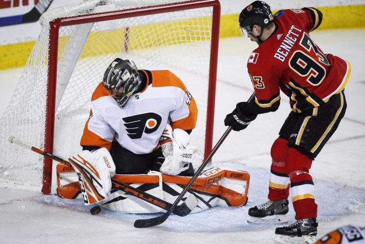 Philadelphia Flyers goalie Anthony Stolarz, blocks a shot from Calgary Flames’ Sam Bennett during third period NHL hockey action in Calgary, Wednesday, Dec. 12, 2018.