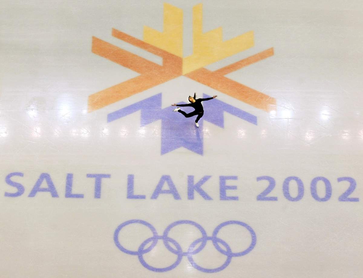 FILE - This Feb. 8, 2002, file photo, shows U.S. champion Michelle Kwan practicing for the women's short program for the Winter Olympic Games at the Salt lake Ice Center in Salt Lake City.